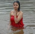 Girl In red dress and in water