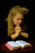 Girl reads Bible