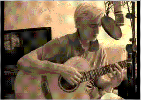 Tom playing guitar