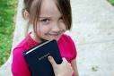 Little girl with Bible